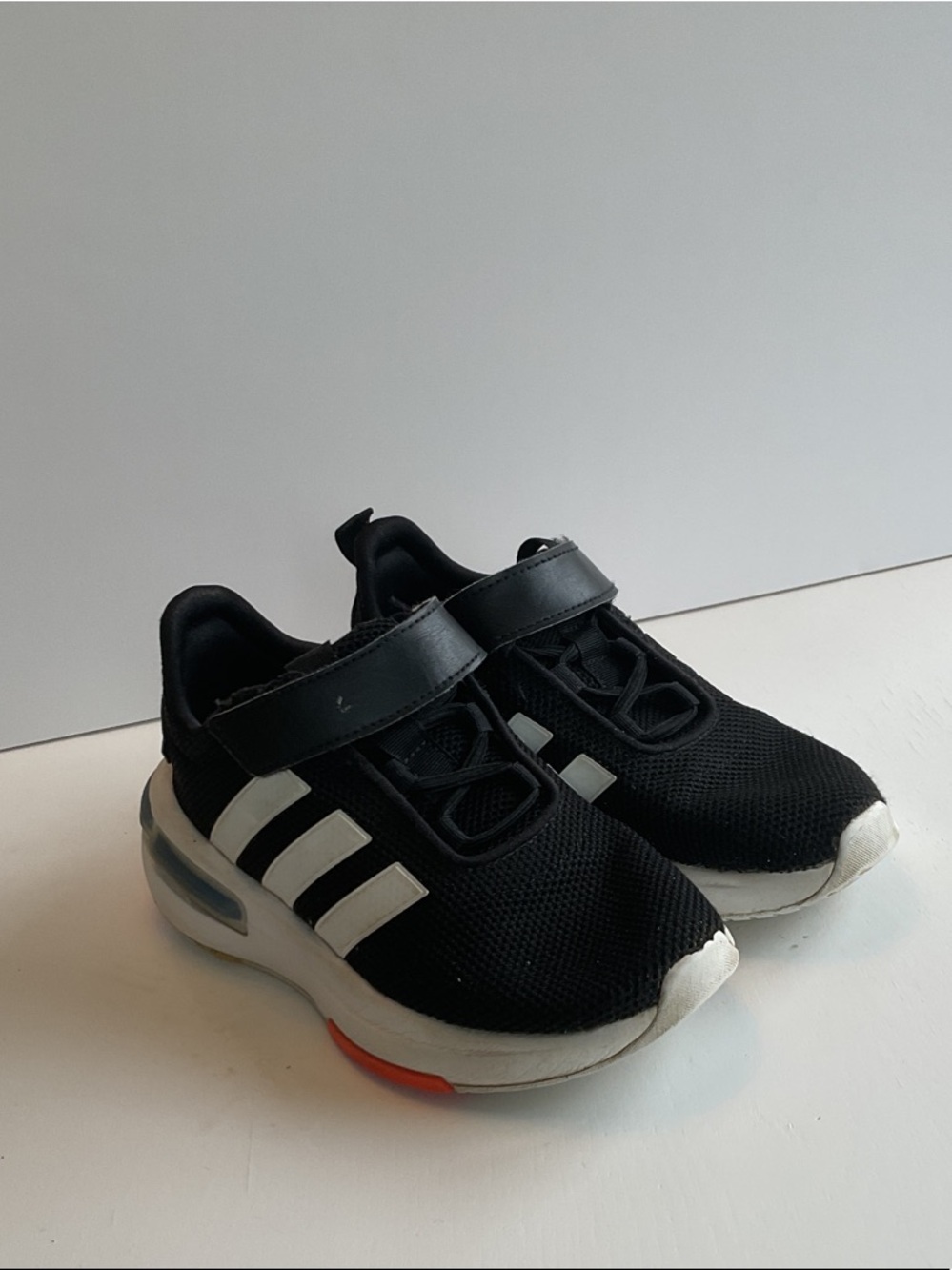 adidas Kids Black Sneakers with White Stripes and Orange Accent